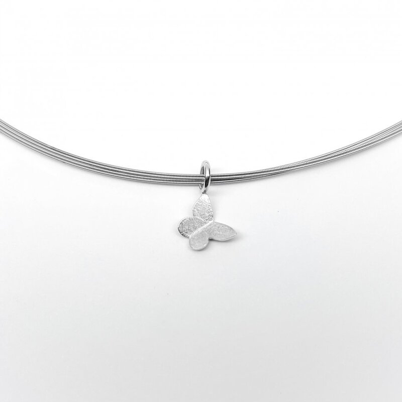  "papillon, pendentif en or blanc 18kt.