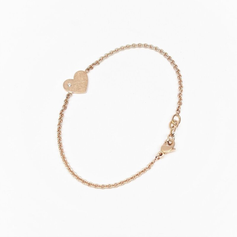 "glittering heart", bracelet coeur en or rouge 18kt et diamant.