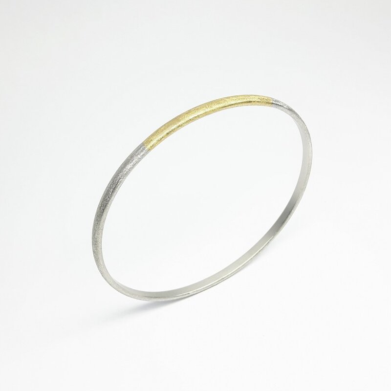 "all-round", bracelet en or jaune 18kt et argent 925/-.