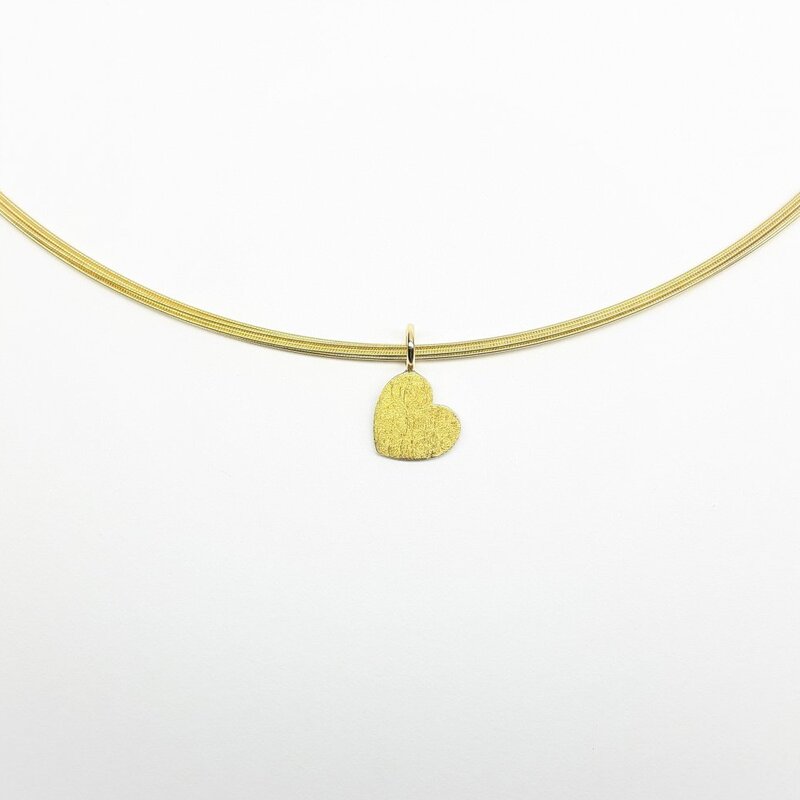 Pendentif coeur en argent, or jaune 18kt et or fin.