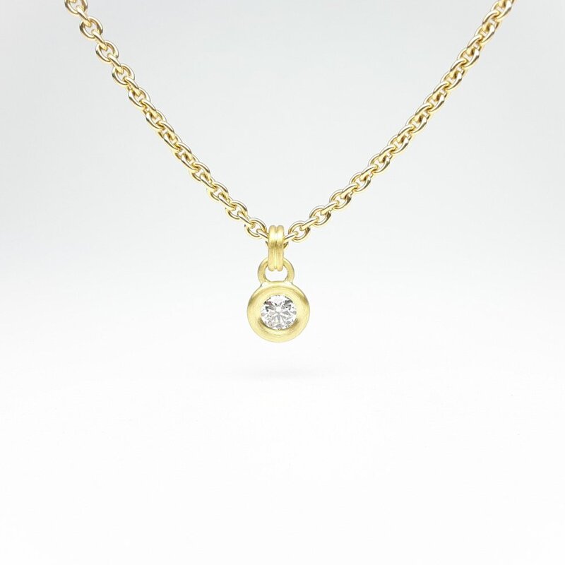 Pendentif en or jaune et brillant Ø4mm 0,25ct.