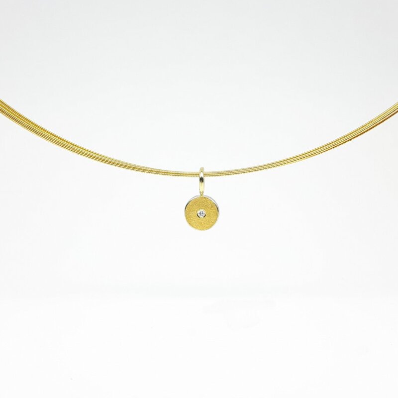 Pendentif en argent 925/-, or fin, or jaune 18kt et diamant.