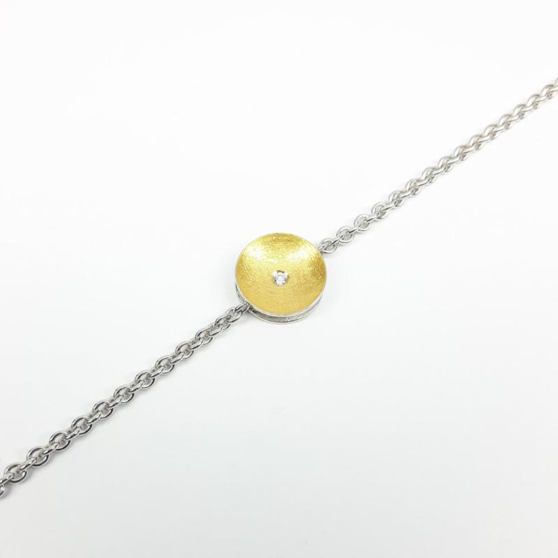 1 Bracelet en argent 925/-, or fin 24kt et diamant.