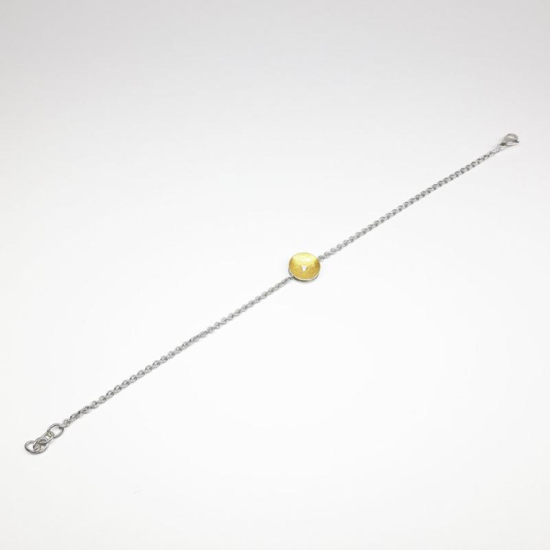 1 Bracelet en argent 925/-, or fin 24kt et diamant.