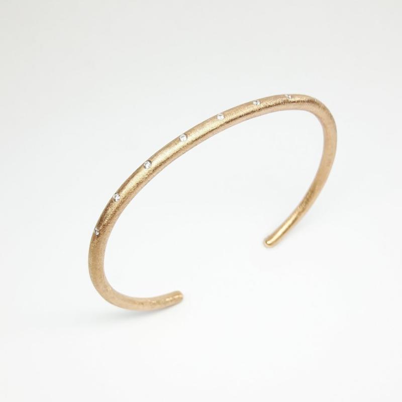 Bracelet en or rouge 18kt et 9 diamants.