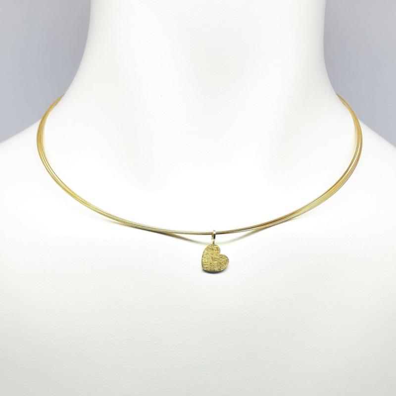 Pendentif coeur en argent, or jaune 18kt et or fin.