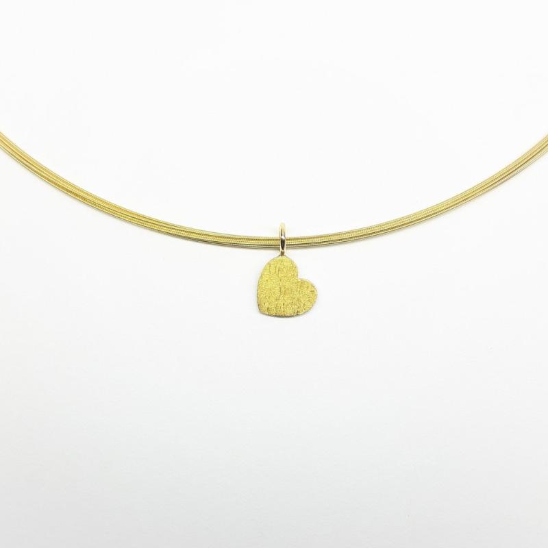 Pendentif coeur en argent, or jaune 18kt et or fin.