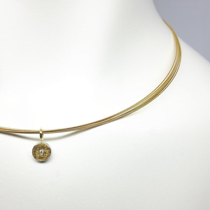 Pendentif en argent 925/-, or fin, or jaune 18kt et diamant.